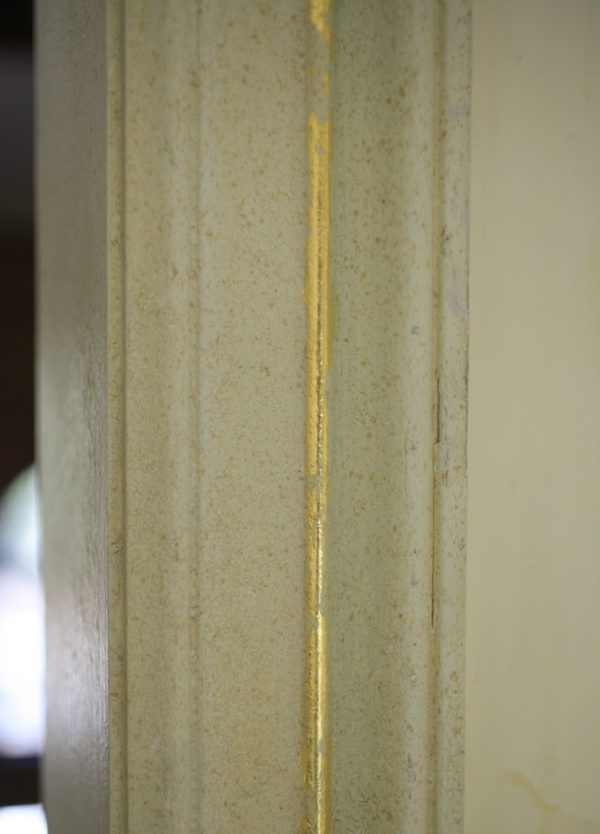 Gold leaf accent detail on trim