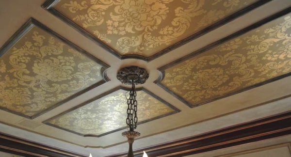 Gilded ornament in patterned ceiling panels